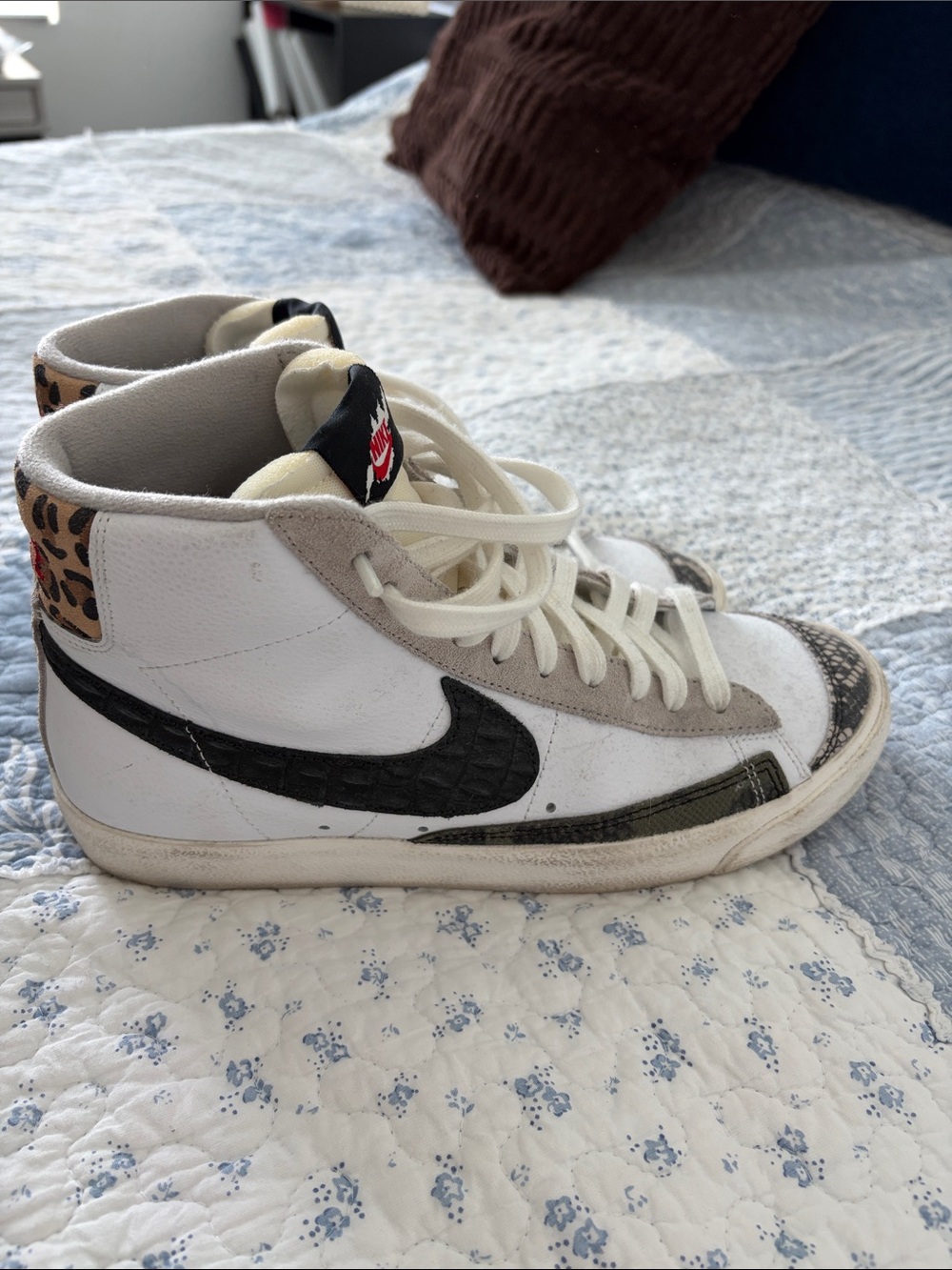 Nike White High-Top Sneakers with Black Swoosh and Leopard Accent